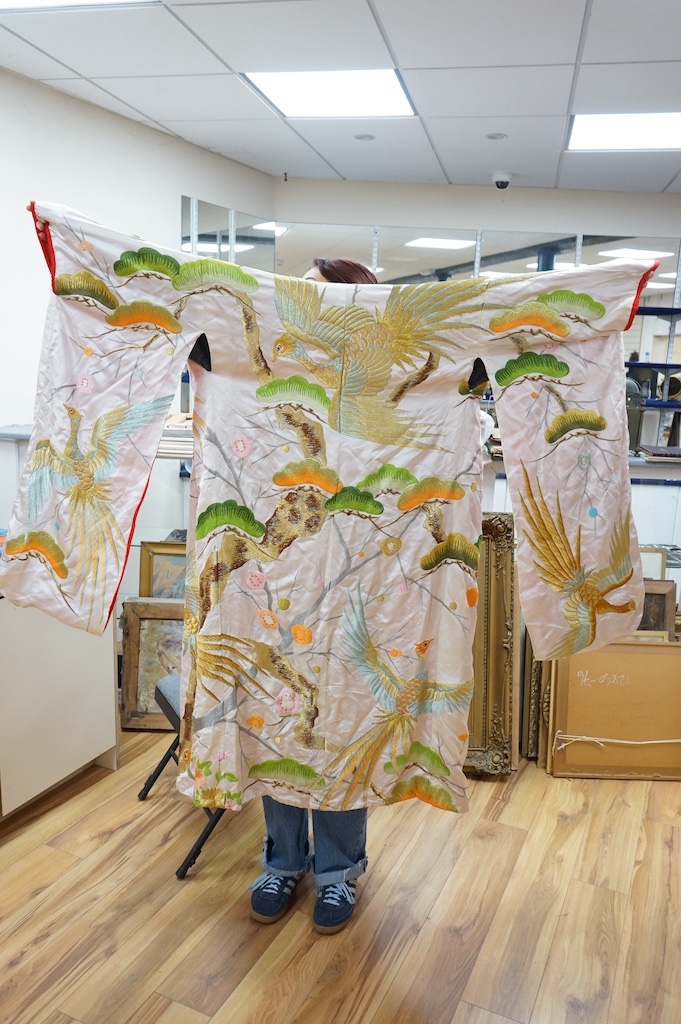 A late 20th century polychrome silk and metallic embroidered Japanese kimono, 133cm long. Condition - the silk is stained in places, which may be able to be cleaned.